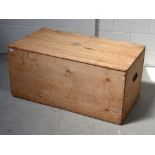 A late 19th century pine blanket box with carrying handles to either side, length 108cm (af).