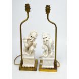 A pair of blanc de Chine Dog of Fo table lamps, height 42cm.