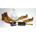 Two pairs of early 20th century shoe and boot stretchers, a partial brass companion set,