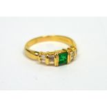 A 14ct yellow gold square-cut emerald (approx 0.43ct) and diamond bar-set ring, size R, approx 4.5g.