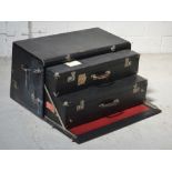 An early 20th century wooden travel chest for the rear of a car,
