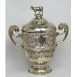 An Edward VII hallmarked silver twin-handled presentation trophy with repoussé floral decoration