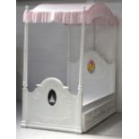 A single Disney princess white four-poster bed with pink canopy, long single drawer to base.