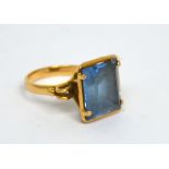 A 9ct gold ladies' dress ring set with rectangular blue stone, size L, approx 5.2g.