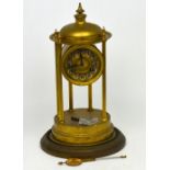 An early 20th century brass eight-day temple clock with reeded supports,