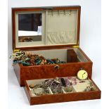 A wooden jewellery box, with printed flower design to lid,