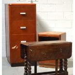 An oak single-door cupboard, an oak four-drawer filing cabinet,