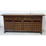 A Spanish-style mahogany sideboard,