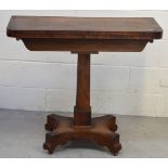 A 19th century rosewood swivel-top gaming table with inlaid brass banding on square pedestal to