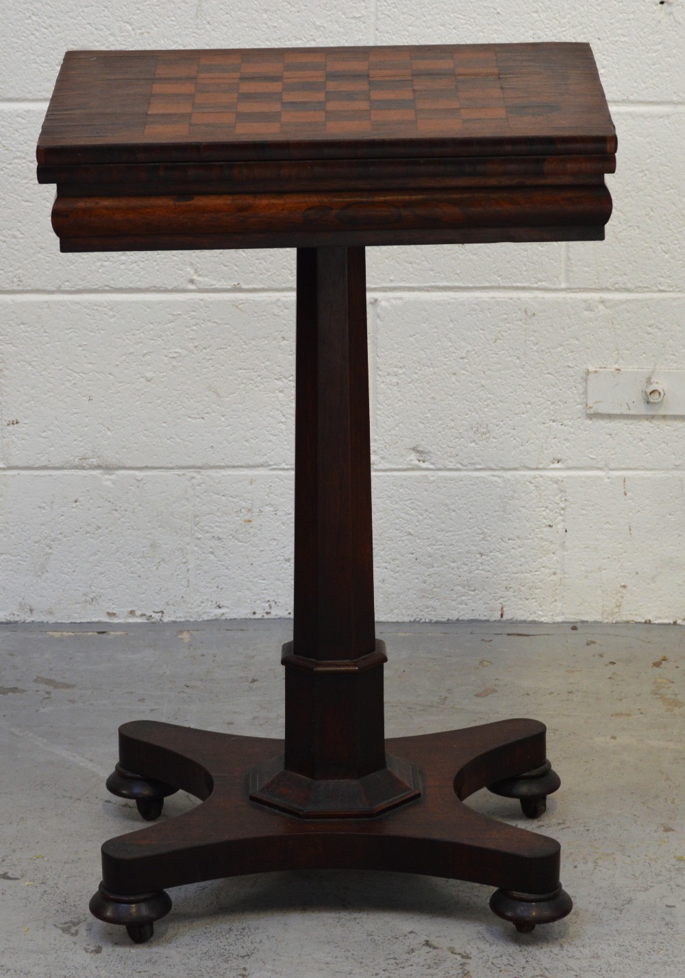 A 19th century rosewood swivel-top inlaid chess/gaming table,