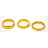 Three 22ct gold ladies' wedding bands, approx combined 9.9g (3).