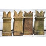 Four Edwardian square-form chimney pots, height of largest 75cm.