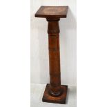 An early 20th century oak column plant stand/torchère, turned decoration on square plinth,