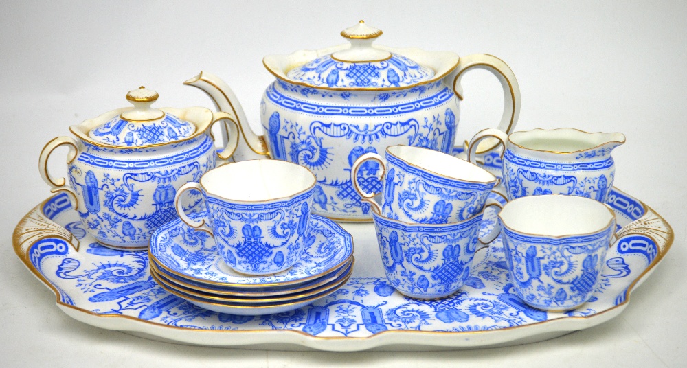 A Royal Crown Derby '4203 Pattern' tea service with blue scrolling and bird decoration,