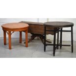 A mahogany shaped top drop-leaf coffee table on plinth base leading to four outswept legs,