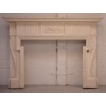 A large Georgian cream-painted mantelpiece with reeded and gadrooned decoration,