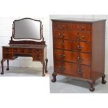 An Edwardian mahogany dressing table with shaped tilting mirror,