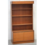 A retro G-Plan style three-shelf bookshelf with two lower doors, 173 x 92cm.