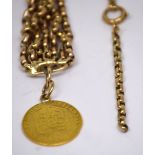 A seven-chain yellow metal bracelet with George III half sovereign mounted a charm and a 9ct yellow