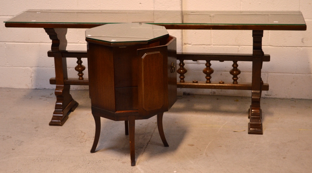 A contemporary oak long side/serving table with central carved baluster decoration to stepped