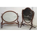 An Edwardian mahogany oval toilet mirror, length 53cm and a further mahogany shield-shaped mirror,