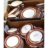 A quantity of Myott, Son & Co Ltd 'New Hampshire' dinner service in maroon and gold.