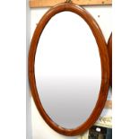 An Edwardian mahogany oval inlaid bevel-edged wall mirror, height 84cm.