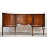 A reproduction mahogany bow-front sideboard, three central drawers and two cupboard doors,