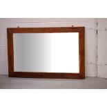 A contemporary hardwood-framed rectangular mirror, 91 x 140cm.