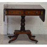An early 20th century reproduction mahogany sofa table with brass inlay banding,