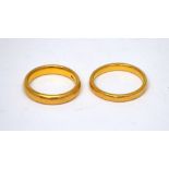 Two 22ct yellow gold wedding bands, sizes Q and O, approx combined 12.4g.