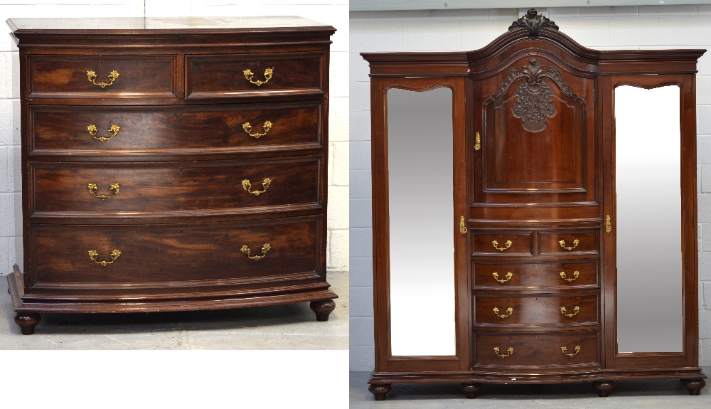 An Edwardian mahogany Waring & Gillow bedroom suite comprising a wardrobe with central carved