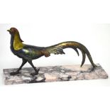 An Art Deco painted spelter pheasant on a marble base, length 38cm.