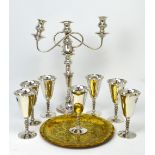 A quantity of silver-plated items comprising a three-branch scrolling candelabrum,