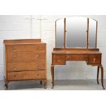 A mid-20th century triple mirror back dressing table,