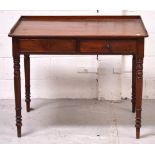 A 19th century mahogany writing desk with galleried back and sides,