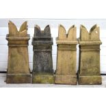 Four Edwardian square-form chimney pots, height of largest 75cm.