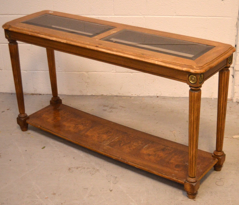 A reproduction walnut console table with two bevelled glass inserts to top,