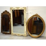 A gilt-framed wall mirror,