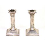 A pair of Victorian hallmarked silver Classical column candlesticks,