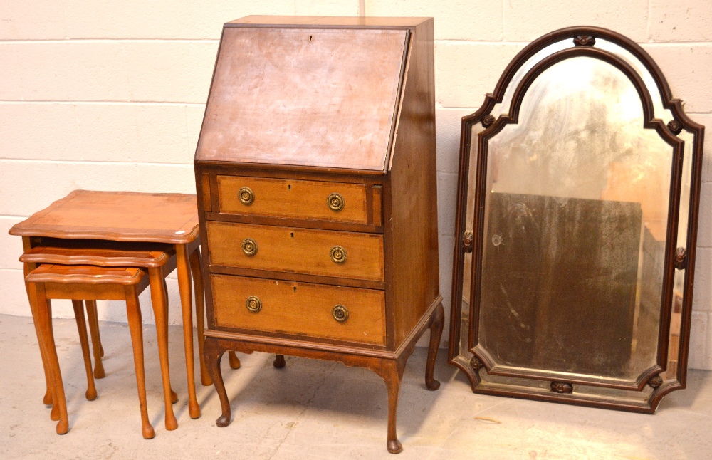 A reproduction mahogany bureau, three drawers on cabriole supports,