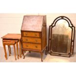 A reproduction mahogany bureau, three drawers on cabriole supports,