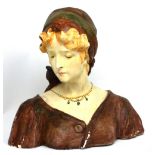A c1930s painted plaster bust of a French lady with headscarf signed H Laubens, height 41cm.