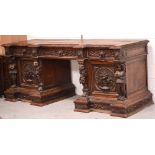 A large late Victorian carved oak pedestal sideboard,