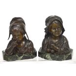 J Daste; a pair of bronze sculptures of a young boy with finger to lip and girl holding cherries,