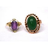 A 9ct yellow gold ring set with oval amethyst and a yellow metal ring set with cabochon green