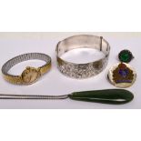 A small quantity of jewellery to include a sterling silver engraved belt bangle,