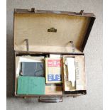 WORLD STAMPS in a leather suitcase including Ideal and Strand albums, loose in cigar boxes etc.