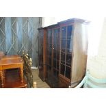 A large early 20th century mahogany and inlaid bookcase with inverted breakfront,