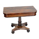 An early 19th century rosewood foldover tea table with rounded square top,